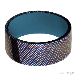 9 mm wide Flat Titanium Damascus band featuring a Royal Blue sleeve.